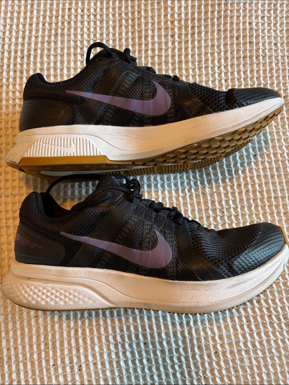 Nike Men’s Black Running Shoes with Purple Swoosh and White Midsole